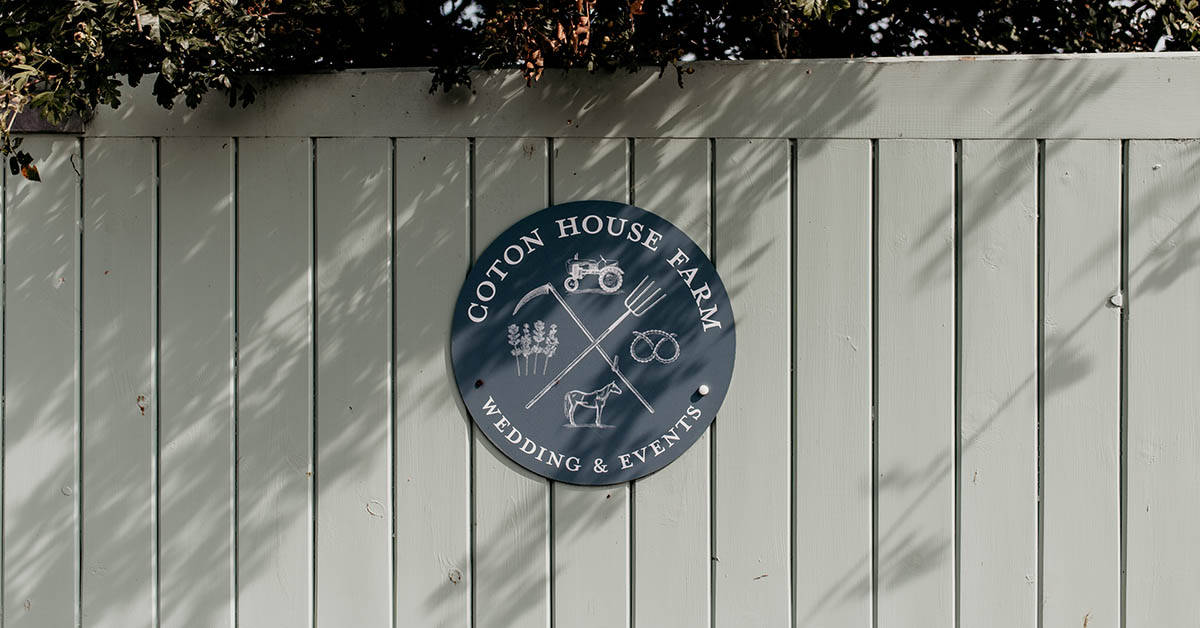 Coton House Farm logo on wall